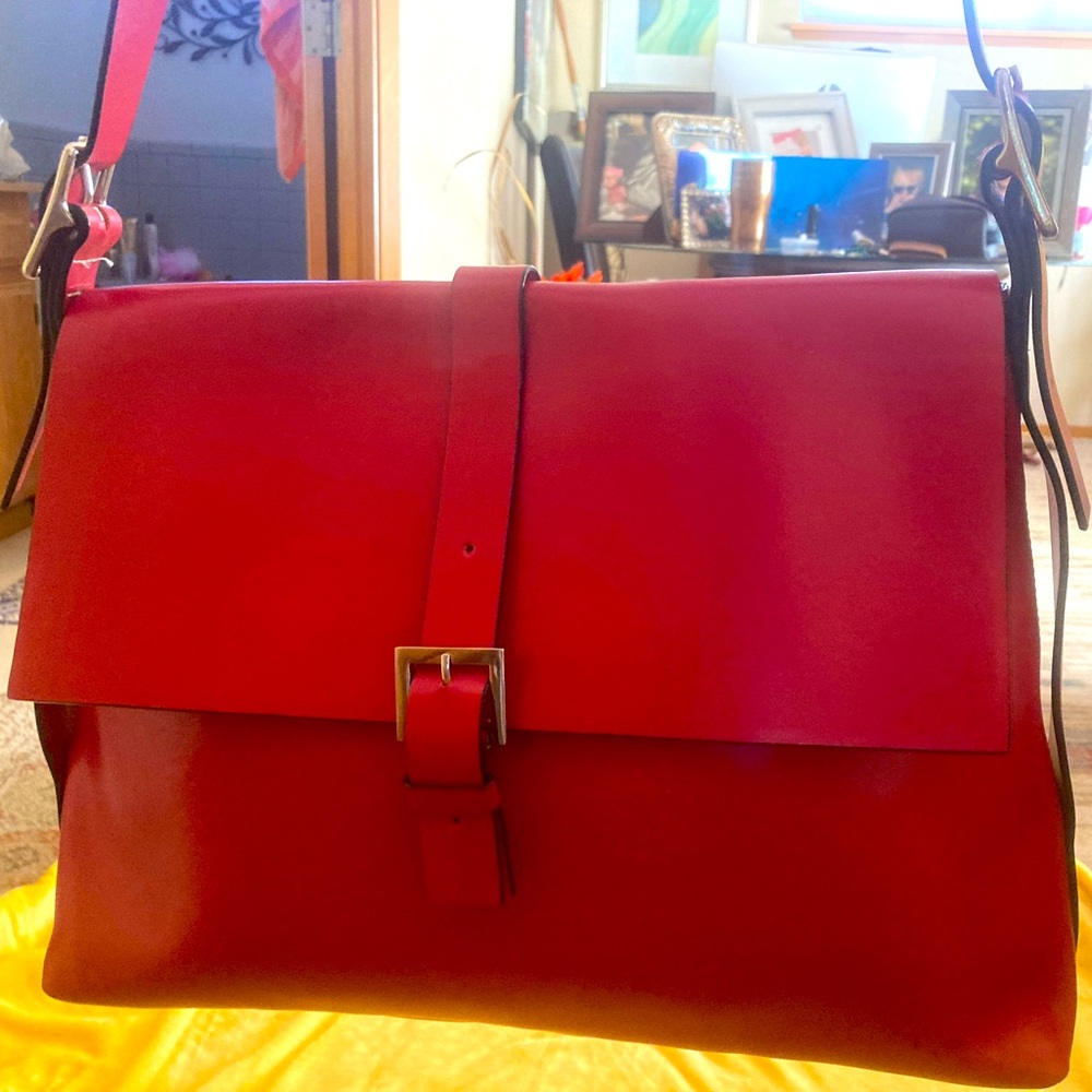 Lodi’s Large Red Leather bag used once perfect shape. 299.00 new. Very beautiful